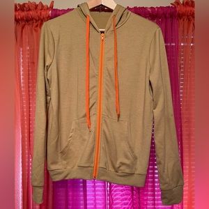 2-pieces large tan/orange jogging suit with a hood.